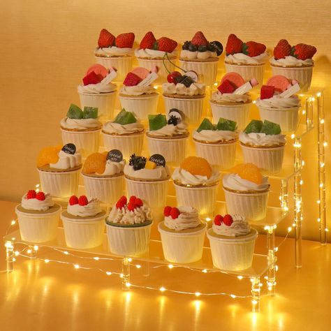 PRICES MAY VARY. The Acrylic Display Shelf】 size is 15.6"x13"x9.9"inch/39.6x32x25cm,the panel is 15.6"inch long and 3inch wide,the height of each tier is 1.8"inch.using lengthened design dessert display riser can accommodate more things than usual 5 tier Cupcake Stand 】Stable and sturdy,which are made of 4mm thick acrylic panel,also have support riser in the middle of the product,make them more stability and durability Tiered Stand 】Easy to install- can be assembled in a matter of minutes, and i Dessert Stand Ideas, Cupcake Display Ideas, Mini Cupcake Display, Cupcake Perfume, Cupcake Wall, Souvenir Display, Tier Cupcake Stand, Tiered Serving Stand, Wedding Cupcake Display