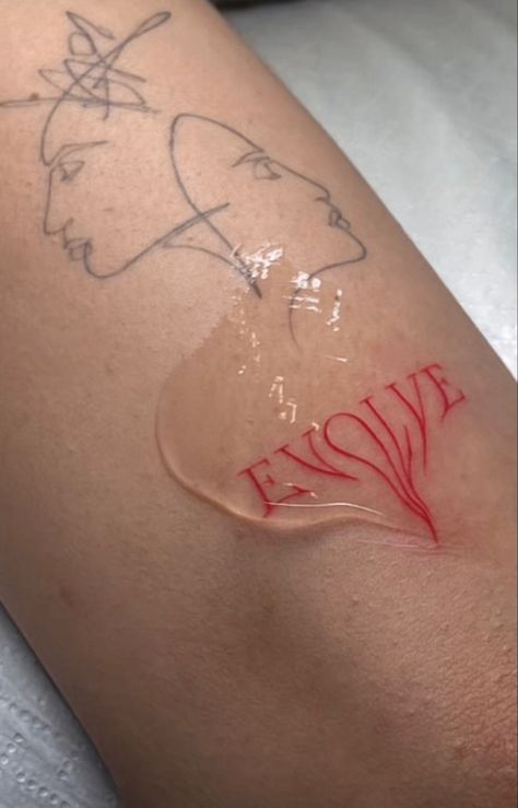 the word « evolve » in red tattoo anchor Dripping Word Tattoo, Evolve Tattoo Words, Red Art Tattoo, Cool Red Tattoos, Red Swirl Tattoo, Red Sticker Tattoo, Dripping Tattoo Ideas, Red Tattoo Faded, Melting Words Tattoo