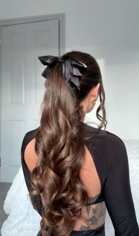 Show off your bold style with these beautiful hair ideas that are sure to turn heads. #BoldHair #BeautifulHair #HairStyleInspo One Curl Ponytail, Ponytail Curls Hairstyles, Black Bow Ponytail, Hairstyles For School Dances Curls, Curled Hair In Ponytail, Elegant School Hairstyles, Ponytail Hairstyles For Wavy Hair, Formal Hairstyles With Bow, Hairstyles With Black Bow