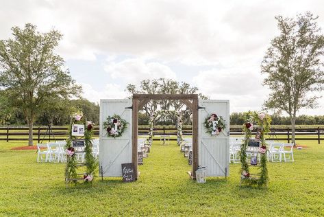 Barn Door Wedding, Chic Wedding Ceremony, White Folding Chairs, White Barn Door, City Wedding Venues, Wedding Ceremony Decor, Wedding Doors, Romantic Outdoor Wedding, Plant City