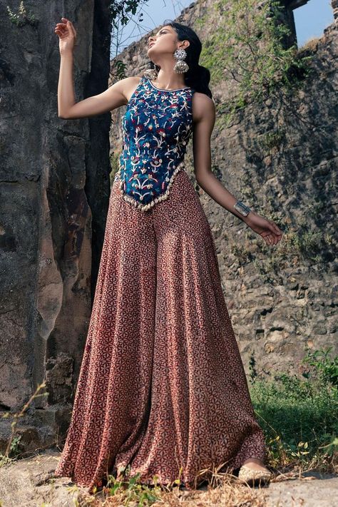 Buy #peach flared #palazzo with indigo blue & pink printed motifs by #NitaraDhanraj at #AzaFashions Shop online now at #Azafashions.com Call +91 8291990059 or email contactus@azafashions.com for enquiries. #wedding #festive #ethnic #tradional #shopping #shoponline #party #reception #bride Haute Couture, Couture, Backless Blouse Designs Sleeveless, Blouse Designs Sleeveless, Palazzo And Top, Cape Skirt, Trendy Outfits Indian, Navratri Dress, Anamika Khanna