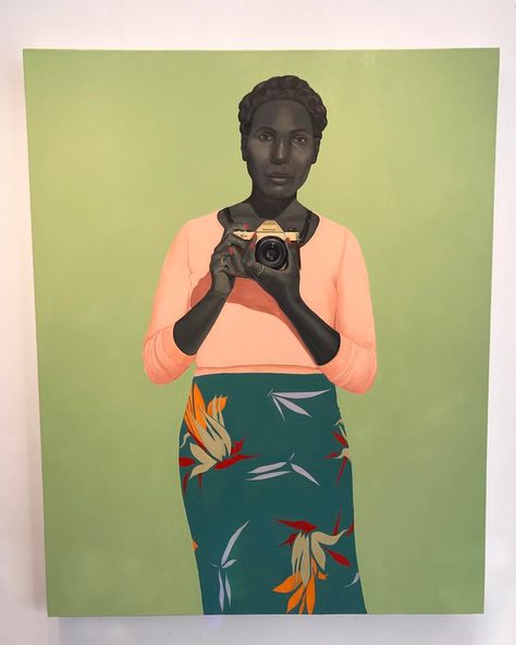 Amy Sherald I see a painting of a woman holding a camera. Her clothes have what looks like flowers and pedals on dark blue while contrasting well with a peach colored sweater. Colors are very vibrant and also complements each other. It feels very simple and the solid color background stands out on the more detailed figure. If there were an absence of shadow and detail in general, the feeling of simplicity would stand out even more. Amy Sherald, Presidential Portraits, Living In America, African American Museum, Telling The Truth, Frida Art, Kehinde Wiley, Bel Art, Digital Museum