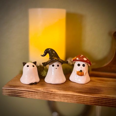 Add a playful twist to your Halloween decor with these adorable handmade  ghost figures, available in three unique styles: Ghost Cat, Ghost Witch, and Ghost Mushroom. Each figure is carefully crafted and hand-painted, bringing a touch of spooky fun and charm to your home. These ghostly characters are perfect for displaying on your mantel, shelf, or desk, adding a bit of festive spirit to any space. Whether you're a cat lover, a fan of all things witchy, or enchanted by the whimsical mushroom gho Cute Ghost Sculpture, Halloween Knick Knacks, Halloween Airdryclay Ideas, Hand Built Pottery Halloween, Mini Halloween Clay Ideas, Clay Ghost Tealights, Halloween Craft Gifts, Halloween Clay Figures, Clay Crafts Simple