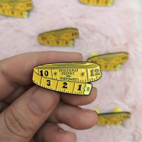 Enamel tape measure lapel pin. Perfect gift for engineers, architects, construction workers, or anyone who loves measuring! #tapemeasurepin #lapelpin . #Mary_Poppins #Enamel_Pin_Packaging #Pin_Packaging #Label_Pin Label Pin, Lgbtq Funny, Jacket Pins, Iron On Embroidered Patches, Practically Perfect, Soft Enamel Pins, Enamel Lapel Pin, Bff Gifts, Soft Enamel