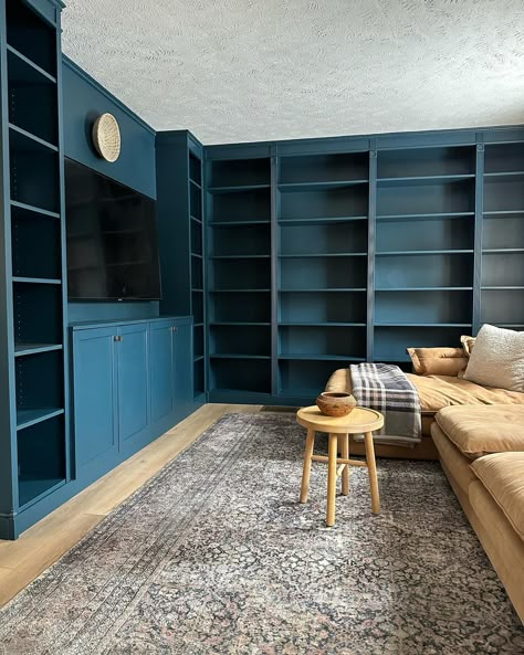 Happy Friday, friends! I realized I never shared photos of the living room library so I decided to jump in on #fridaysareforphotos cause it feels like OG IG days🙌 I clearly need more books😅 but am enjoying decorating with my antique and thrift finds! This room feels almost complete but tell me… do I need to paint the ceiling Hague Blue as well?🧐🤪 #livingroomlibrary #homelibrary #bookshelves #hagueblue #builtinbookshelves Dark Blue Built In Bookshelves, Dark Teal Library, Living Room Library Ideas, Room Library Ideas, Builtin Bookshelves, Paint The Ceiling, Blue Library, Blue Bookshelves, Blue Bookcase