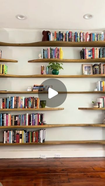 Wall Decor Daily on Instagram: "POV: You’ve been daydreaming about the perfect bookshelves, and now they’re finally a reality! 🛋️ 

These wavy wooden shelves add both character and functionality to any room. 

Imagine your favorite reads, treasured trinkets, and a few stylish plants beautifully displayed. 

❤️this like we do?

Tag someone who needs to see this. 

Thanks to @Katy for showing us how it’s done!
.
.
.
.
.

#booktok #bookshelves #floatingshelves 
#customshelving #interiorstyling" Wave Shelves, Apartment Deco, Wall Mounted Bookshelves, Open Bookshelves, Bookshelves In Living Room, Hanging Plant Wall, Custom Shelving, Bookcase Design, Bookshelf Design