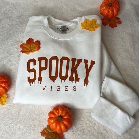 Spooky Vibes Crewneck with Texas Orange lettering SIZING : The crewnecks are unisex, which means they do run a bit larger. Please look at our size chart to guarantee you are getting the correct fit for you! CARE : To ensure the longevity of your crewneck, wash with cold water and dry inside-out or hang dry. Fall Cricut Shirts, Halloween Horror Nights Outfit, Spooky Crewneck, Fall Shirt Ideas, Fall Shirts Vinyl, Halloween Tshirt Ideas, Cricut Clothing, Fall Crewneck, Disney Halloween Shirts