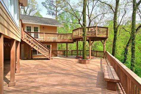 Large two level deck with outlook of surrounding trees Diy Gravel Patio, Gravel Patio Ideas, Steep Backyard, Gravel Pavers, Landscaping Around Deck, Slope Landscape, Two Level Deck, Backyard Deck Ideas, Composite Decks