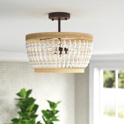 Add some boho flair to your entryway or hallway with this 3-light semi-flush mount. It features a rustic iron frame that's accented with natural rope designs in a light brown hue, and it's draped in weathered-white wooden beads for a coastal feel we love. This flush mount has an open candelabra inside that aims ambient light all around your space from three 40W bulbs, which are sold separately. Plus, this piece works well with a dimmer switch to create the lighting you want. Rated for dry locati Ceiling Hugger Light Fixture, Modern Coastal Ceiling Lights, Semi Flush Hallway Lighting, Semi Flush Entryway Lighting, Coastal Semi Flush Mount Lighting, Coastal Entryway Lighting, Coastal Kitchen Lighting Fixtures, Coastal Flush Mount Lighting, Lakehouse Lighting