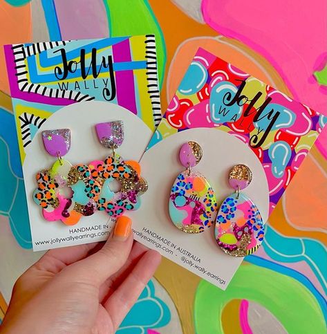 Jolly Wally on Instagram: "🌈🌈 Meet Macy! (On the left) and her friend …. Unknown name yet (please provide suggestions😁) both available next Thursday night in restock!! 7pm! . . . . . . . . . . #whatheteacherwore #supporthandmadegoods #resinearrings #earrings #resin #glitterearrings #madeinaustralia #teacherearrings #girlssupportgirls #earringaddict #earringaddiction #jollywally #statementstuds #statementdangles #glitter #statementearrings #earringsoftheday #colour #neoncolour #colourfulaccess Resin Glitter Earrings, Resin Earrings Ideas, Resin Earrings Diy, Diy Resin Earrings, Colourful Earrings, Diy Resin Projects, Earrings Resin, Resin Projects, Crafts To Make And Sell