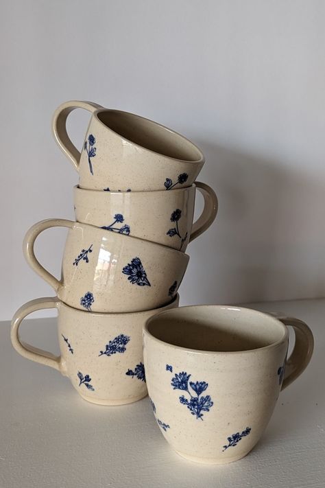 Off-white handmade ceramic mugs with delicate cobalt flowers on a neutral background Cottagecore Ceramic Mug, Tea Mugs Aesthetic, Hand Made Ceramic Mugs, Cottagecore Pottery, Bohemian Dishes, Flower Hacks, Simple Paper Crafts, Mug Inspiration, Floral Transfers