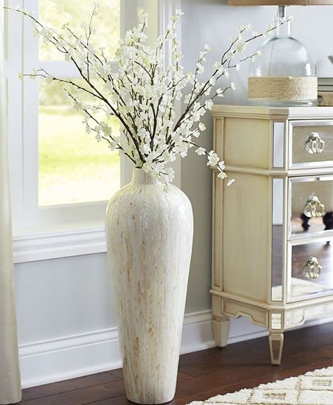 @coupleofagents || Who knew plants, fake or real, could make all the difference in a living room scene?! This extra large vase really brings the room to life! We love the beige and neutral tones too 🌿  #CoupleOfAgentsRealEstate #myphx Vase With Sticks, Vases Decor Living Room, Floor Vase Fillers, Large Vases Decor, Floor Vase Decor, Large Floor Vase, Tall Floor Vases, Big Vases, Foyer Decorating