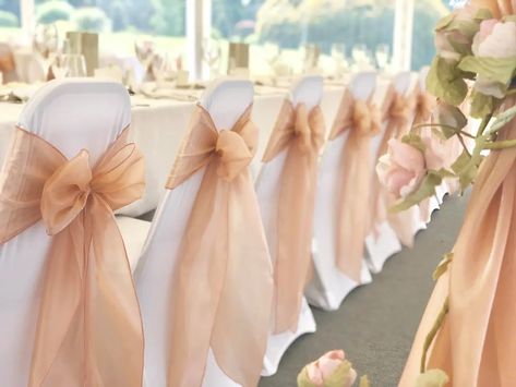 Magical Touch Venue Styling in Essex - Wedding Chair Covers | hitched.co.uk Tulle Chair Decorations, Wedding Chair Cover Ideas, Chair Bows Wedding, Wedding Chair Decor, Wedding Chair Cover, Wedding Columns, Wedding Chair Covers, Wedding Ceremony Chairs, Beach Wedding Pink