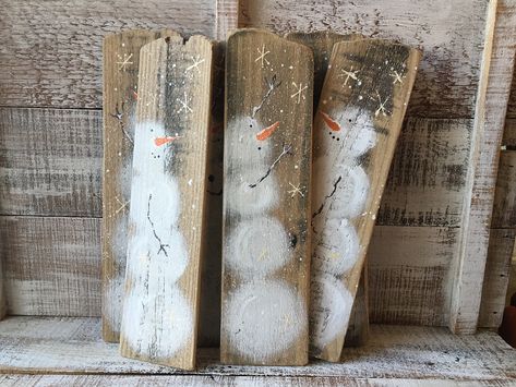 "Listing is for one snowman painting. Choose the one you would like, A, B, C, D, E or F from the last 3 photos (if it is still available). (I will combine shipping and refund any overage if you need more than one) These adorable snowmen are completely hand painted freehand on recycled wood. The wood was once a fence that I saved from going to the landfill. I maintained as much of the woods imperfections as I could, only sanding the wood enough to be able to paint on it. Some of the pieces have h Rustic Wood Snowman, Christmas Art On Wood, Decorating With Skis, Painted Snowmen On Wood, Pallet Wood Christmas Decor, Hand Painted Snowman, Old Fence Board Projects, Wood Snowman Crafts, Wood Board Painting Ideas