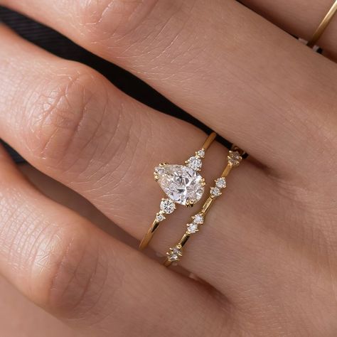 Melanie Casey Fine Jewelry | Pear cut diamond Pictorial Ring. Which wedding band would you choose? Minuet or Twist & Turn? The first 3 images are the Minuet Band.… | Instagram Pear Diamond With Wedding Band, Melanie Casey Wedding Band, Engagement Rings Simple Minimalist Melanie Casey Fine Jewelry, Pear Engagement Ring With Wedding Band, Dainty Engagement Rings Melanie Casey Fine Jewelry, Melanie Casey Unveiled Ring, Dainty Gold Engagement Ring Melanie Casey Fine Jewelry, Engagement Rings Melanie Casey, Ring With Wedding Band