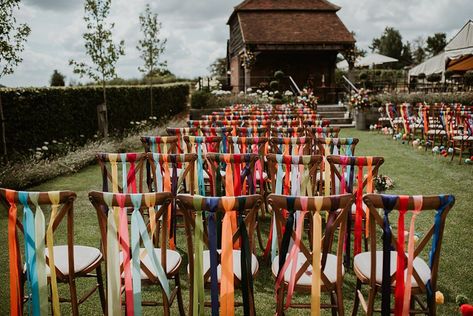 Wedding Chairs Ribbon, Ribbons Hanging From Trees Outdoor Weddings, Ribbon Ceremony Wedding, Hanging Ribbons Wedding, Colorful Ribbon Wedding, Ribbons At Wedding, Rustic Rainbow Wedding, Wedding Decor With Ribbons, Thrifted Rug Wedding Aisle