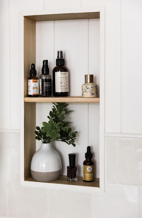 White vertical shiplap with square tile beneath and inset wood shelves. Wall Storage Small Bathroom, Bathroom Wall Inserts, Bathroom Wall Built In Shelves, Shelves In Wall Bathroom, Bathroom Niche Over Toilet, Bathroom Shelf In Wall, In Wall Shelving Bathroom, Bathroom Backsplash Shelf, Inset Wall Cubby