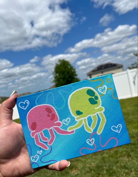 I used paint markers for the jellyfish and arylic paint for the background !:3 Spongebob Jellyfish Painting Canvas, Sponge Bob Jelly Fish Painting, Cute Drawings And Paintings, Painting Ideas On Canvas Paint Markers, Spongebob Posca Art, Jellyfish Painting Aesthetic, Cute Fun Painting Ideas, Drawings With Paint Markers, Things To Paint For Friends