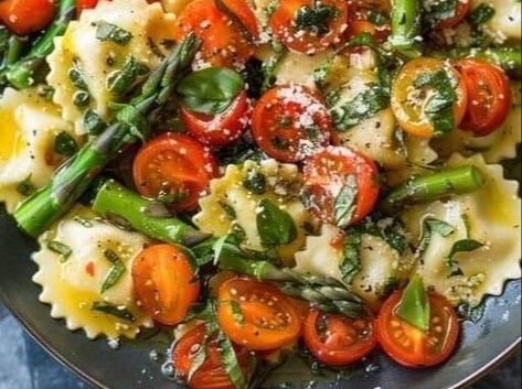 Quick and Easy Ravioli with Asparagus, Tomatoes, and Garlic Herb Sauce Recipe! - NewsBreak Garlic Herb Sauce Recipe, Ravioli With Asparagus, Crisp Asparagus, Garlic Herb Sauce, Easy Ravioli, Hamburger Potato Soup, Asparagus Garlic, Satisfying Meals, Ravioli Recipe