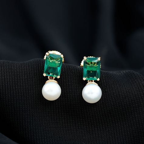 Product Details Make a statement with these stunning Octagon Cut Created Emerald earrings, set in a Prong Setting and paired with elegant Freshwater Pearl Drops. Crafted from high-quality gold, these Pearl earrings are a perfect blend of classic elegance and modern design, making them an ideal accessory for any occasion. Product Information SKU SHP-EARRINGS082210232 Weight 1.15 gm (Approximate) FRESHWATER PEARL INFORMATION No.of Stones 2 Pieces Total Weight 4.47 Carat (Approximate) Dimension(app Pearl Emerald Earrings, Emerald Earrings Drop, Freshwater Pearl Drop Earrings, Lab Created Emerald, Emerald Earrings, Pearl Drop Earrings, Pearl Drop, Classic Elegance, Earrings Set