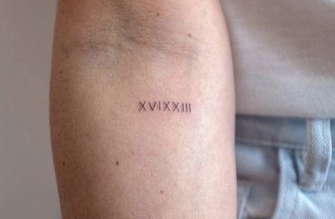 28 Roman Numeral Tattoo, Modern Roman Numeral Tattoo, Fine Line Tattoo Roman Numerals, 22 Roman Numeral Tattoo, 22 Roman Numeral, Dainty Roman Numeral Tattoo, Small Roman Numeral Tattoo, Roman Numeral Birthday Tattoo, Birthdate Tattoo Ideas