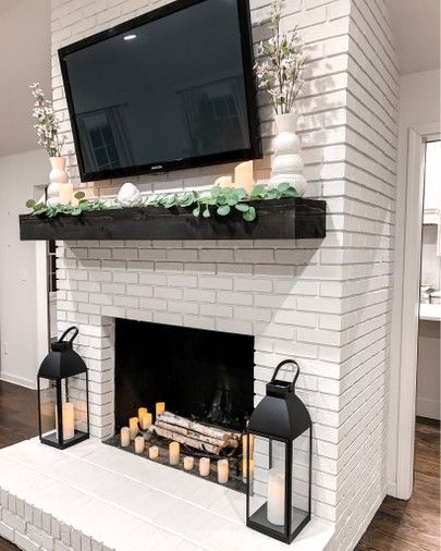 Living room farmhouse home decor  White fireplace Black lanterns  Remote control amazon candles Eucalyptus garland Spring home decor    http://liketk.it/2BWSl #liketkit @liketoknow.it #LTKunder50 #LTKunder100 #LTKstyletip #LTKspring #LTKsalealert #LTKhome #LTKfamily Neutral Farmhouse Living Room, Living Room Decor White, Room Decor White, Spring Home Decor Ideas, Modern Farmhouse Fireplace, White Brick Fireplace, Farmhouse Living Room Decor, Neutral Farmhouse, Andong