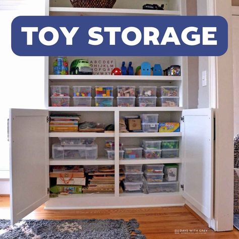 Toy cabinet with toys organized in bins for kids to play with. Tall Toy Storage Ideas, Cabinet For Toy Storage, Little People Storage, Tv Stand Toy Storage, Toy Closet Organization, Toy Cupboard, Toy Room Storage, Toy Cabinet, Daycare Furniture