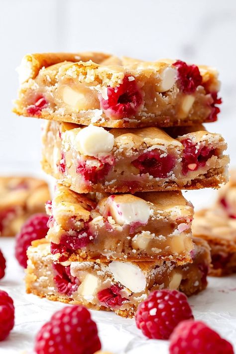 Raspberry and white chocolate blondies combine the rich, fudgy taste and texture we all know and crave in a blondie, with a refreshing fruity twist. Raspberry Blondies, Desserts Bars, White Chocolate Desserts, Raspberry And White Chocolate, Chocolate Blondies, White Chocolate Blondies, Raspberry Bars, Raspberry Desserts, Pure Cocoa Butter