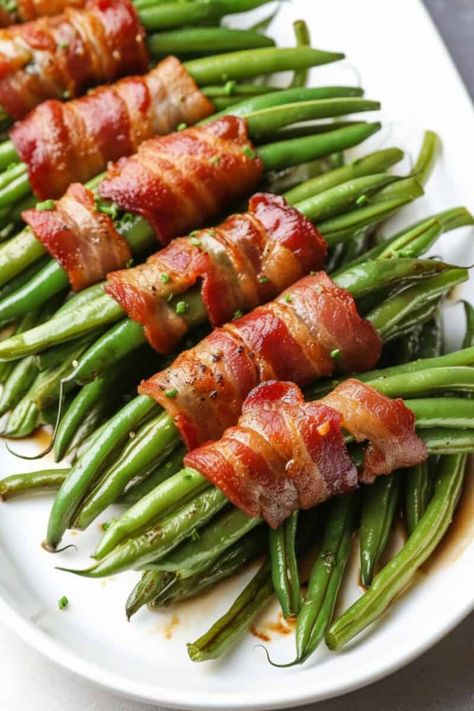 flat lay image of perfectly cooked Bacon Wrapped Green Beans, showcasing the crispy bacon enveloping tender green beans, seasoned with garlic and rosemary. Green Bean Bundles, Bacon Wrapped Green Beans, Honey Fried Chicken, Christmas Side Dishes, Creamy Potato Salad, Low Carb Sides, Green Bean Recipes, Quick Weeknight Meals, Thanksgiving Side Dishes