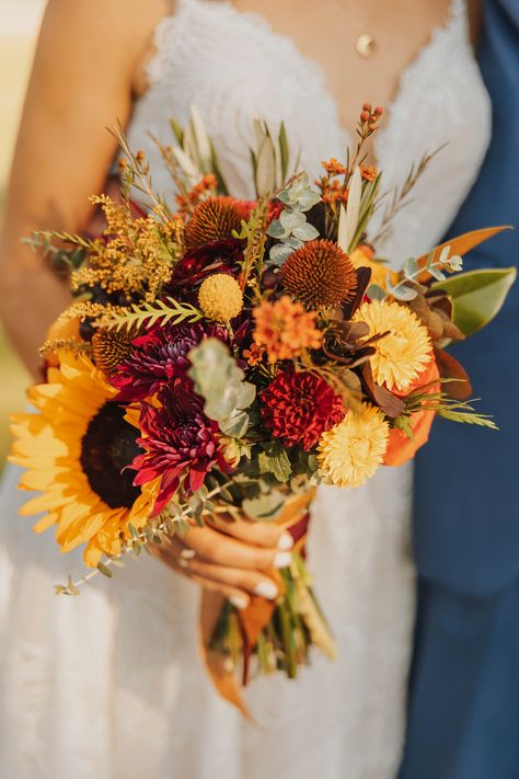 Autumn wedding at a Rustic Montana venue during golden hour! Fall Bouquet Wedding Sunflowers, Terracotta Wildflower Bouquet, Autumn Bridal Flowers, Fall Bouquet Sunflower, Fall Wedding Flowers Sunflowers, Whimsical Fall Bouquet, Fall Wedding Ideas October Centerpieces, August Bouquet Wedding, Simple Sunflower Wedding Bouquet