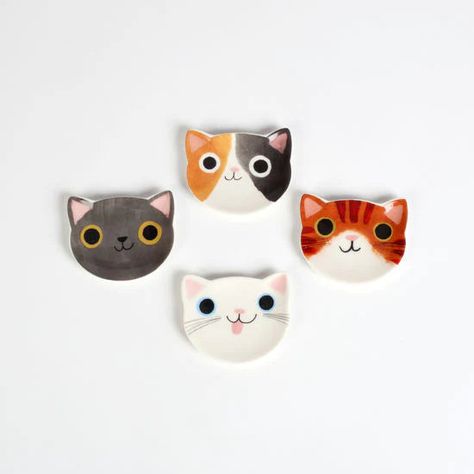 If you're a cat lover, you'll adore our adorable Cat Ring dishes. These delightful little accents are the perfect addition to any cat enthusiast's collection. Available in a variety of styles, these charming jewelry dishes feature cute cat designs that will melt your heart. Not only are they a delightful decor piece, but they also serve a practical purpose. Use them to safely and stylishly store your favorite pieces of jewelry or trinkets, ensuring they're always within reach and beautifully displayed. Made from high-quality materials, these Cat Ring dishes are built to last, making them the perfect gift for yourself or the cat lover in your life. Choose from our selection of styles and bring a touch of cat-inspired whimsy to your day-to-day life. Dimensions: ﻿2" x 2.5" Material: porcelain Tangled Jewelry, Jewelry Dishes, Planet Ring, Ring Dishes, Cat Ring, House Plant Care, Bookshelf Decor, Candle Accessories, Insulated Mugs