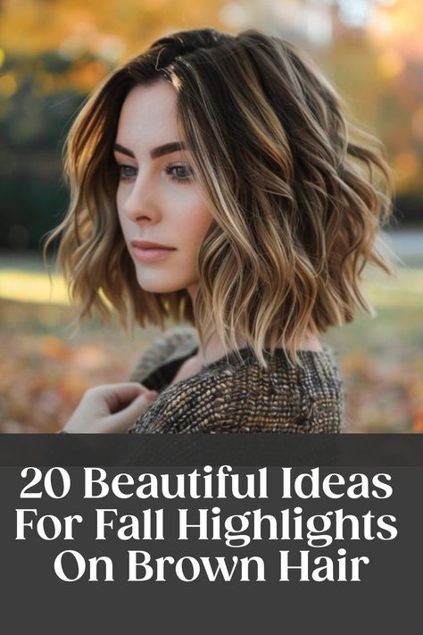 Woman with wavy brown hair and fall highlights in a park with autumn leaves. Text: "20 Beautiful Ideas For Fall Highlights On Brown Hair".