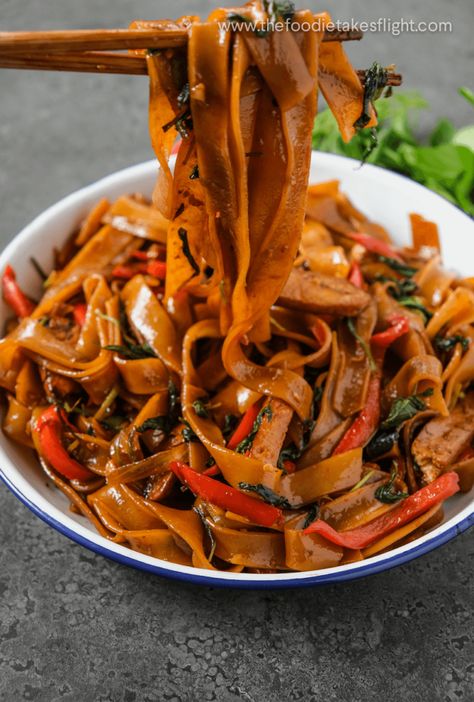 Vegan Thai Drunken Noodles (Pad Kee Mao) - The Foodie Takes Flight Pad Kee Mao Recipe, Vegetarian Stir Fry Sauce, Thick Rice Noodles, Pad Kee Mao, Thai Drunken Noodles, Vegetarian Stir Fry, Pad Thai Noodles, Drunken Noodles, Vegan Fish