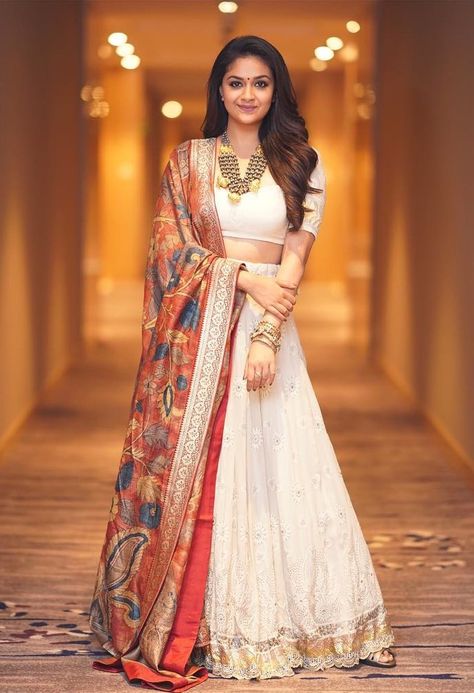 Shopzters | Styling cues to steal from Keerthi Suresh! White Off Shoulder Dress, Pengantin India, Keerthi Suresh, Half Saree Lehenga, Indian Outfits Lehenga, Keerthy Suresh, Lehnga Dress, Half Saree Designs, Indian Gowns