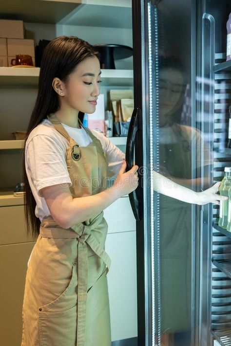 Cafe worker taking a non-alcoholic drink from the shelf royalty free stock photography Cafe Worker, Drink Shelf, Alcoholic Drink, Cute Cafe, Stock Photography Free, Non Alcoholic Drinks, Non Alcoholic, Display Cabinet, Dress To Impress