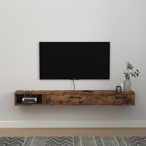 PRICES MAY VARY. [Space-saving & Large Capacity]: Our wall mounted media console is perfect for homes with limited space. With its wall-mounted design, it frees up valuable floor space, allowing you to use the area for other purposes.With 2 doors design provides ample storage space for all your TV accessories. It's perfect for keeping your living room neat and organized. [Easy to Assemble & Clean]: Our floating media cabinet comes with all the necessary hardware and instructions for easy assembl Large Floating Shelf Under Tv, Wall Mounted Tv With Shelf Underneath, Mounted Tv Storage, Tv With Shelf Underneath, Floating Cabinet Under Tv, Narrow Tv Console, Tv With Floating Shelves, Tv Set Up Bedroom, What To Put Under Mounted Tv