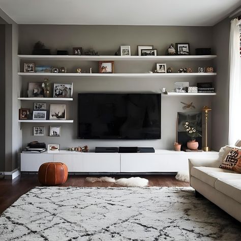 Movie Night Must-Have: A Functional and Stylish TV Wall! This TV wall is ready for your next movie marathon. The large screen takes center stage, while the spacious built-in cabinets offer plenty of storage for movies, games, and anything else you need for a fun night in. The floating shelf adds a touch of style for displaying decorative objects or memorabilia from your favorite films. What are your essential elements for creating the perfect movie-watching experience at home? Share your... Movie Shelf Ideas, Movie Shelf, Your Next Movie, Perfect Movie, Movie Watching, Art Shelves, Movie Marathon, Built In Cabinets, Mounted Tv