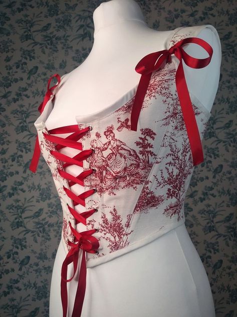 Handmade from ivory and red toile de jouy cotton fabric with ruby red ribbon for lacing and shoulder bows. Designed by Ivory Black. Corset Stays, Red Toile, Medieval Clothes, Corset Blouse, Red Corset, Apple White, White Corset, Crop Top Dress, Fashion Sewing Pattern