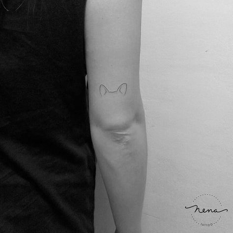 44 Tiny Minimalist Tattoo Designs by Nena Tattoo | TattooAdore Small Dog Ear Outline Tattoo, Corgi Ears Tattoo Minimalist, Minimalist Dog Ear Tattoo, Akita Tattoo Minimalist, Puppy Ears Tattoo, Shiba Inu Ears Tattoo, Husky Dog Ear Tattoo, Dog Ears Tattoo Ideas, Dog Ears Fine Line Tattoo