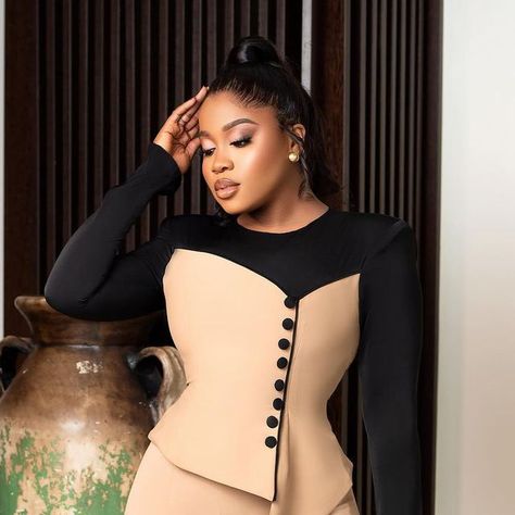 ERIKAN on Instagram: "The Daphne Set is a pant set that consists of our signature pant and a shoulder padded top that has long sleeves and an asymmetric detail at the end of the top. The top is designed with a mix of two colors with buttons attached to give a more unique look. Price N236,500 (338$) - Sizes 6-14 N246,000 (352$) - Sizes 16-20 Fabric Type: 100% Crepe Fabric Texture: Smooth Production time : 5-7 working days" Formal Fitted Set With Padded Blouse, Fitted Pre-draped Blouse Piece, Fitted Pre-draped Sets, Elegant Black Padded Crop Top, Luxury Fitted Pre-draped Tops, Edgy Fashion Outfits, Long African Dresses, Black Gown, Crepe Fabric