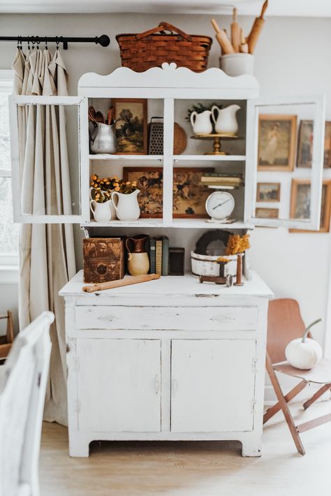 Vintage white hutch styled with fall tones and vintage items.  White pumpkins, old books, rolling pins, ironstone pitchers and antique pictures. Kitchen Hutch Decorating Ideas, How To Style A Hutch, Kitchen Hutch Decor, Living Room Hutch, Hutch Styling, White Hutch, Vintage Hutch, Fall Tones, Kitchen Hutch