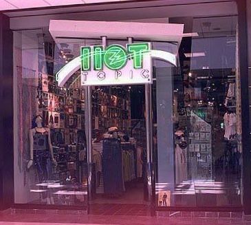 Hot Topic: Mid to late 1990's store design... with 1980's green, neon letters... before the chain's awkward, decade-long, hellfire and goth phase. 80s Mall, Old Hot Topic, Mall Rats, Starcourt Mall, 70s Childhood, Dead Malls, Neon Letters, Vintage Mall, Mall Stores