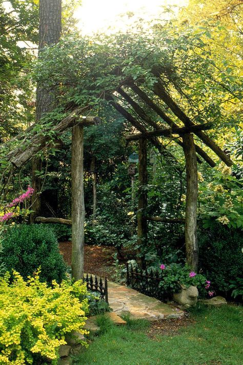 A rustic arbor can add country charm to your garden or backyard. Featuring natural materials and simple designs, these outdoor structures can help define an entrance or provide support for climbing vines and flowers. Create your own picturesque garden setting with this collection of rustic arbor ideas. #archtrellis #gardenarch #archwayideas #landscaping #gardenarbor #bhg Villa De Leyva, Rustic Garden Design, Rustic Arbor, Garden Cultivator, Garden Archway, Garden Arbor, Garden Entrance, Garden Yard Ideas, Backyard Garden Design