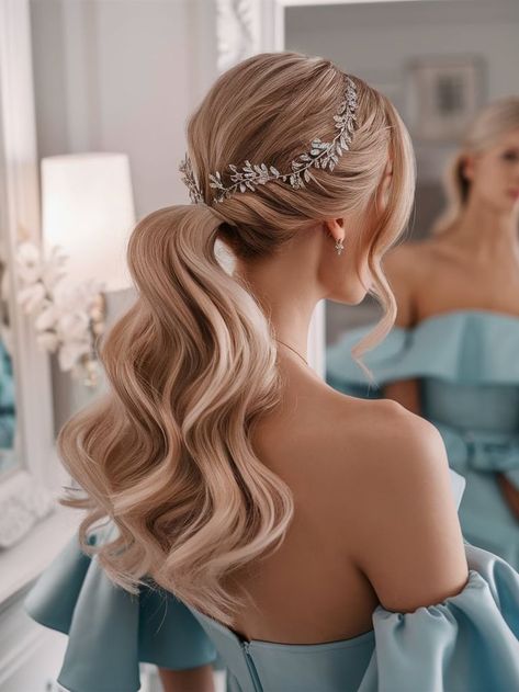 A soft, wavy ponytail styled elegantly for a bridal look. The hairstyle features a sparkling silver leaf hairpiece that enhances the sophisticated charm, perfect for weddings or formal occasions. Bridal Ponytail Hairstyles With Veil, Loose Ponytail Hairstyles Wedding, Bridal Hair Ponytail With Veil, Elegant Ponytail Hairstyles Wedding, Wavy Ponytail Hairstyles, Pony Tailed Hairstyle Wedding, Bridal Ponytail Hairstyles, Bride Ponytail, Bridal Pony