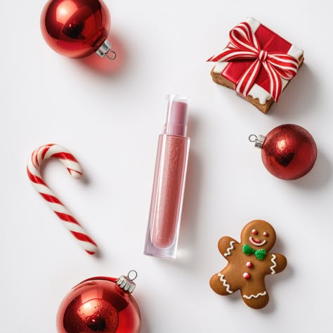 AI cosmetics Photography, A glistening lip gloss tube is surrounded by vibrant Christmas ornaments, a twisted candy cane, and a delightful gingerbread man cookie. This photo captures the essence of holiday beauty essentials, serving as inspiration for simplistic yet vivid product photography. Christmas Candy Photoshoot, Christmas Cosmetics Photography, Christmas Cosmetics, Holiday Editorial, Dear Me Beauty, Skincare Design, Winter Core, Product Photography Inspiration, Product Photography Studio