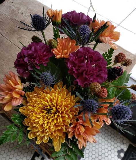 Mum Arrangements, Mum Outdoor Arrangements, Spider Mum Flower Arrangements, Large Autumn Floral Arrangements, Orange And Purple Floral Arrangements, Purple Carnations, Fall Arrangements, Table Arrangements, Jewel Tones