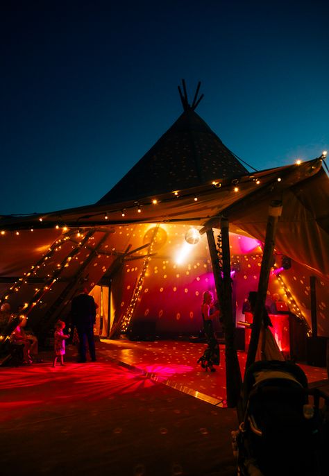 Tipi Party!   Photo Credit: @Emily Little Photography  #tipishowcase #weddingshowcase #weddinginspiration #bohowedding #tipilighting #wedding #gianttipi #festivaltipi #venue #wedspiration #bride #festivalwedding #instawedding #love #tipiwedding #tipi #teepee #rusticwedding #rustic #marquee #outdoorevent #party #tipievent #hertfordshire #tipihire #outdoorwedding #tipis #countryside #countrytipis Festival Wedding Reception, Garden Marquee Party, Mini Festival Ideas, Festival Photo Booth Ideas, Wedding Rave Party, Boho Festival Wedding, Teepee Marquee, Music Festival Wedding Theme, Festival Wedding Theme