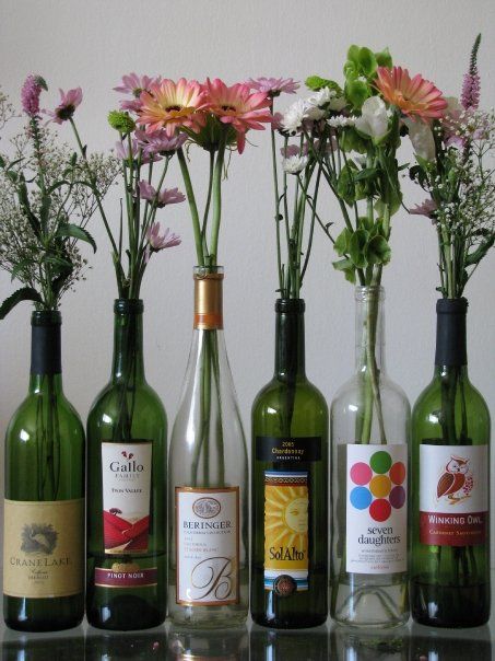 wine not? Wine Bottle Aisle Decor, Wine Bottle As Vase, Wine Bottles With Flowers, Plants In Wine Bottles, Flowers In Wine Bottles, Wine Bottle Flower Arrangements, Wine Bottle Flower Vase, Italian Dinner Party Decorations, Wine Bottle Flowers