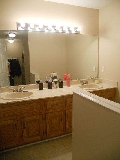 I have these awful "hollywood" style light fixtures in two of my bathrooms, but I am on a tight budget and can't afford the cost of completely replacing them. Any ideas on how to make covers for them, or any other ways to transform these without spending too much? Hollywood Lights Makeover, Bathroom Light Bar, Diy Vanity Lights, Hollywood Bathroom, Hollywood Vanity Lights, Washroom Ideas, Light Fixture Makeover, Lighting Makeover, Light Fixture Covers