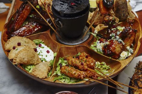 Pu Pu Platter Dos and Don'ts for Any Recipe - Thrillist Pu Pu Platter, Chinese Buffet, Kalua Pork, Pu Pu, Bbq Wings, Dinner And A Movie, Dos And Don'ts, Chinese Garden, Barbecue Chicken